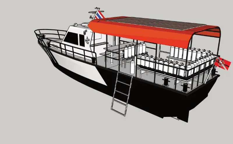 The Pirm Udom Sub dive boat, photographed from an angled rear view, showcasing its spacious dive deck.