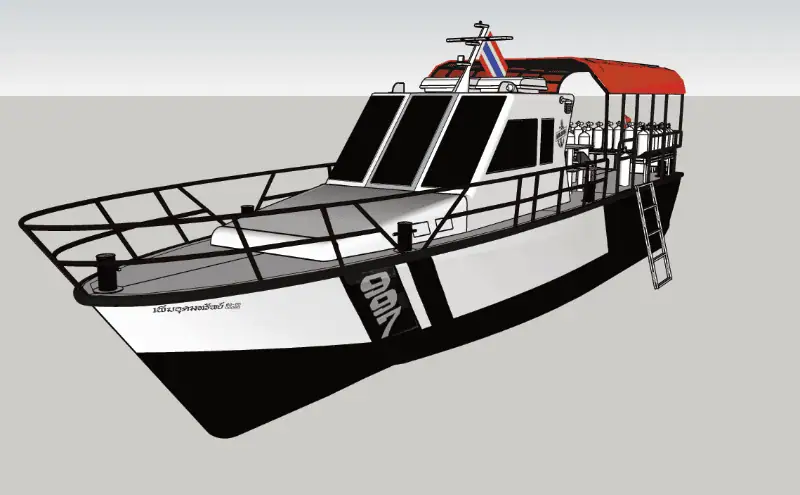 The Pirm Udom Sub dive boat, photographed from an angled front perspective, showcasing its semi-planing steel hull design.